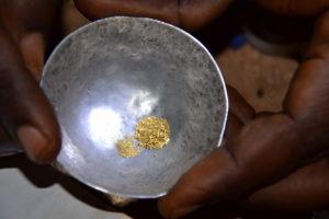 A trader weighs gold from an artisanal mine site in Democratic Republic of Congo. Shawn Blore/Partnership Africa Canada